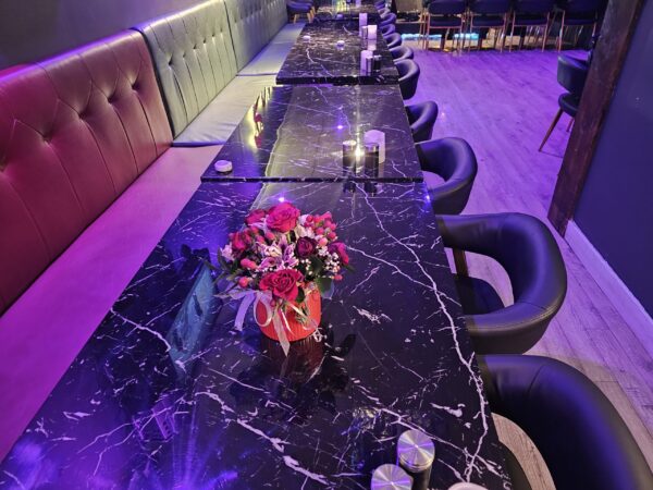 Black restaurant chair with faux marble restaurant table