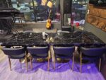 Black restaurant chair with faux marble restaurant table