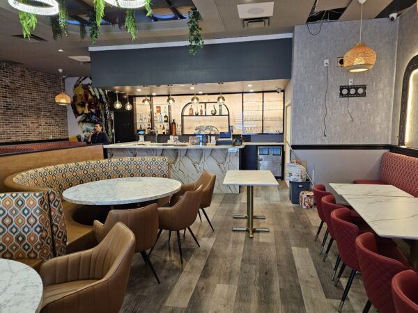 Tan faux leather restaurant seating with fabric back