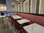 Red faux leather restaurant seating with fabric back