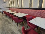 Red faux leather restaurant seating with fabric back